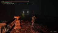 Use the lever on the north side's room to turn on the lights and lower the platform (Image via FromSoftware)